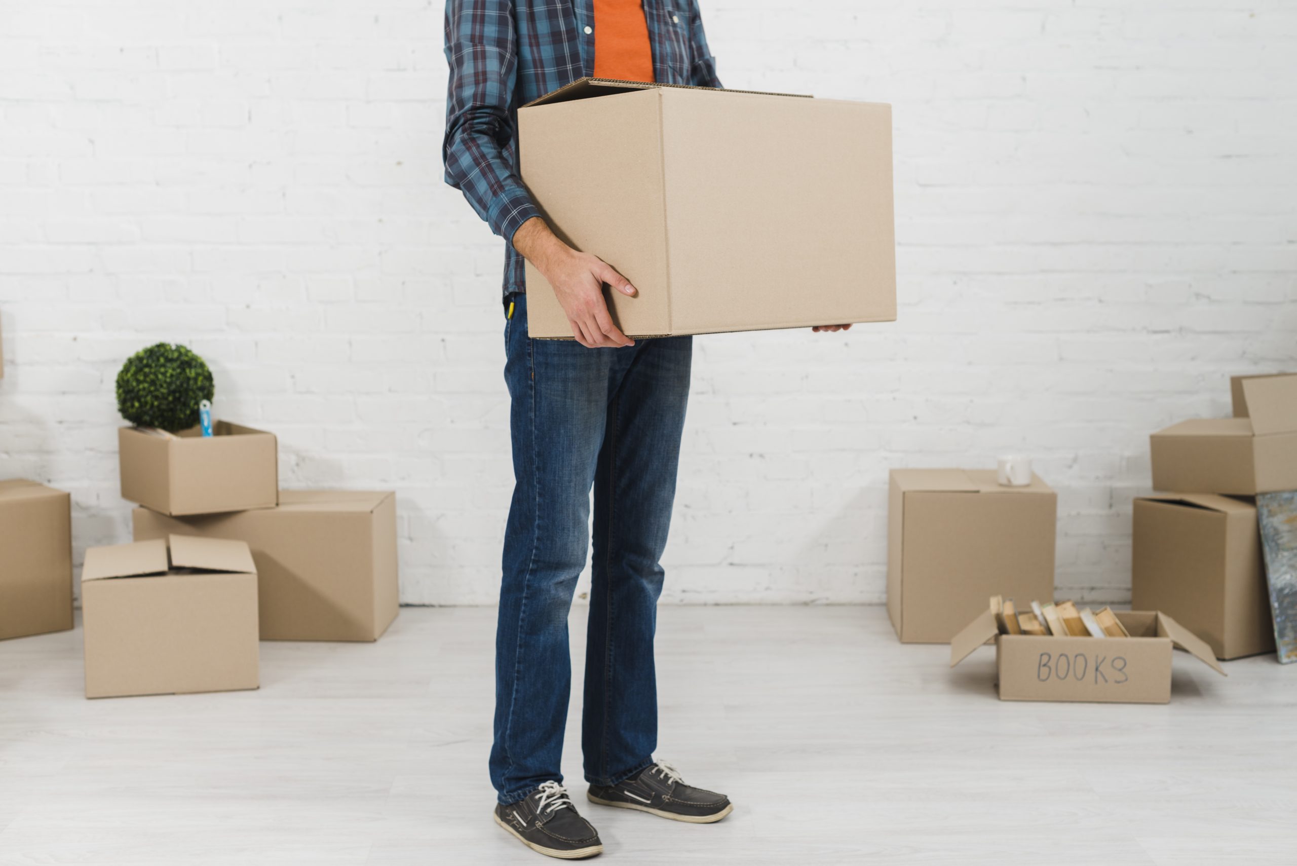 low-section-man-holding-cardboard-box-his-hand
